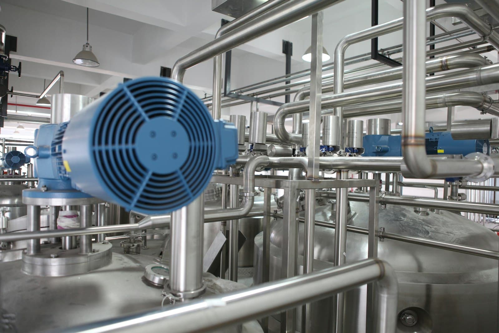 Stainless steel reactors and pipework inside a process plant